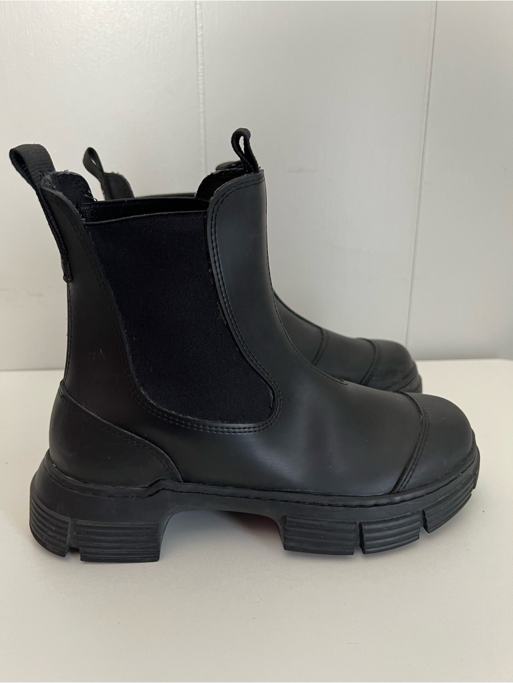 GANNI 
Chelsea boots feature a chunky cleated rubber sole and elastic side panel